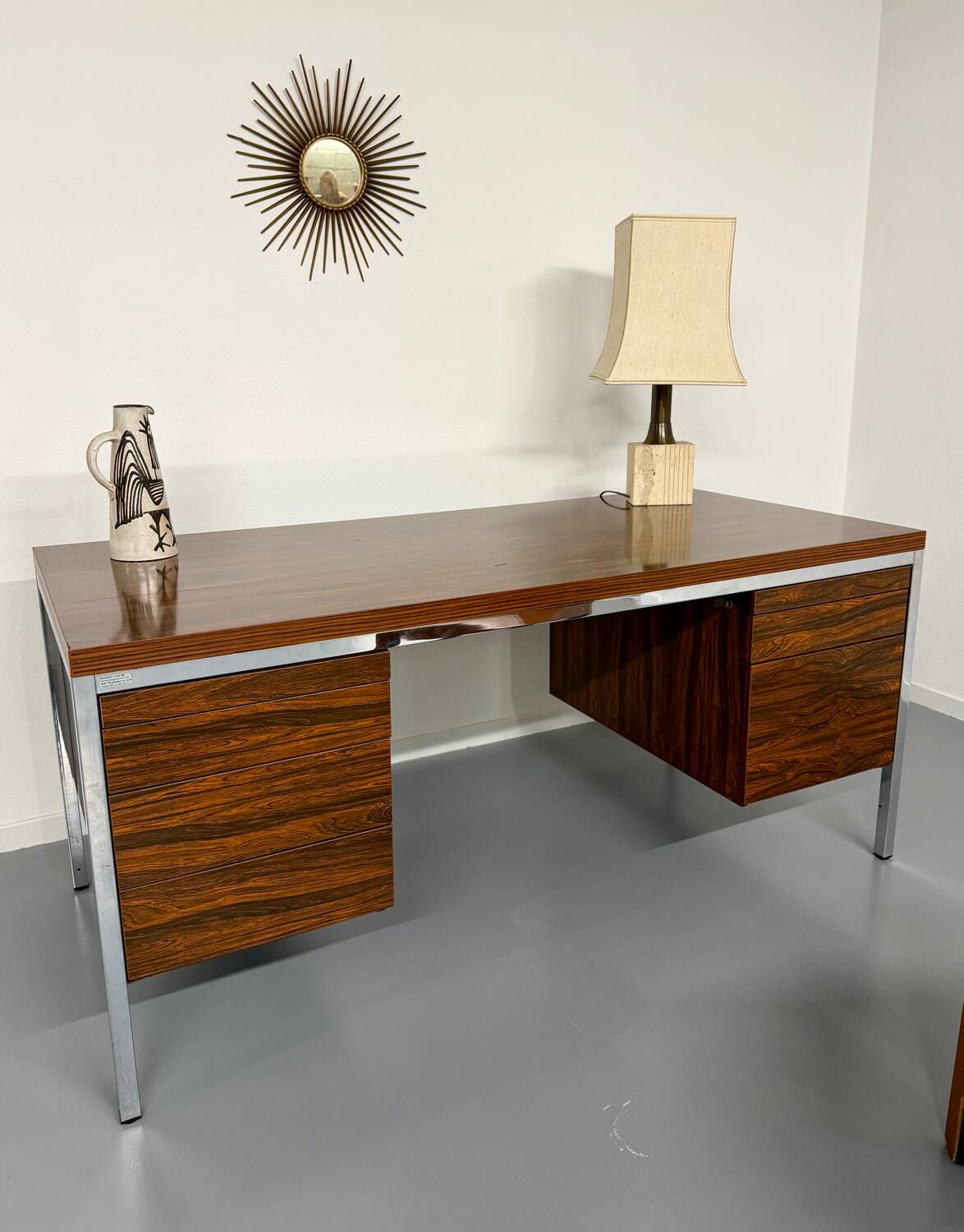 Vintage desk with rosewood veneer and chrome metal design from the 1970s.