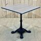 Modern bistro table, cast iron base, laminated top