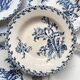 10 mismatched vintage soup plates in blue, green, and red ironstone