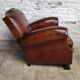Club chair with moustache back and lion feet.