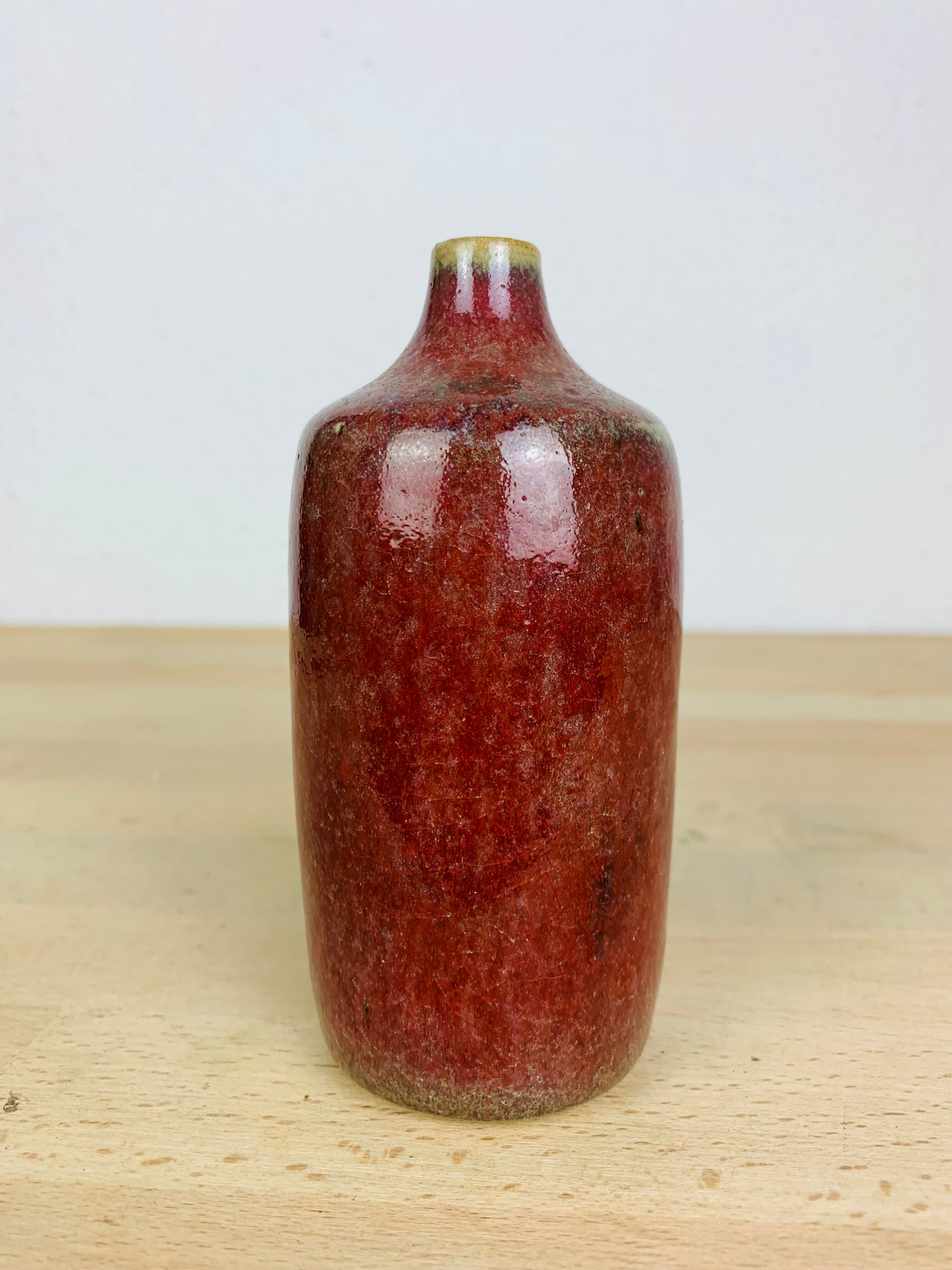 Vase red ceramic bottle signed