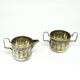 Set of sugar bowl and milk jug, neoclassicism with art deco influences, silver-plated brass, Belgium, 1930s.