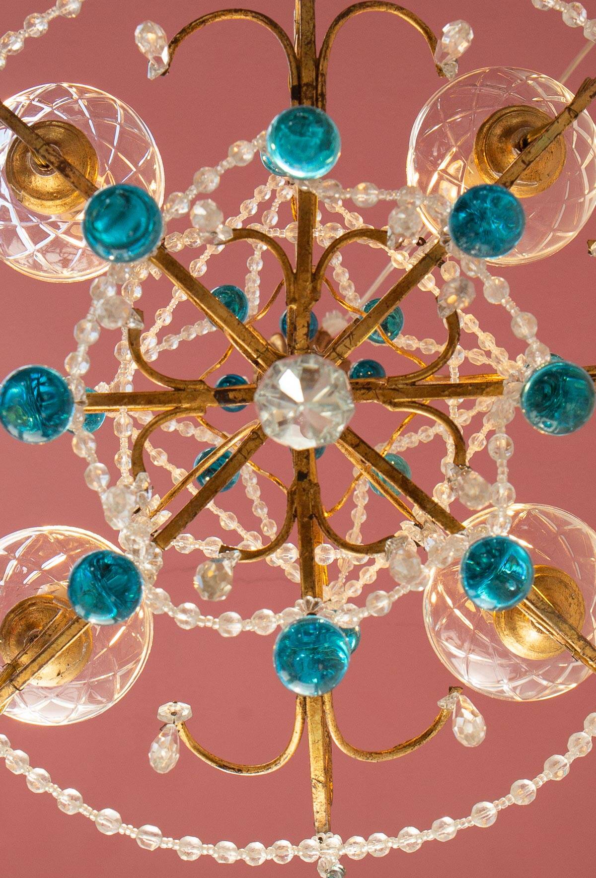 Italian chandelier in gold metal and blue crystal drops
