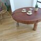 Brutalist circular coffee table in mahogany