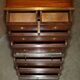 Pair of vintage military campaign high chests of drawers with leather tops.