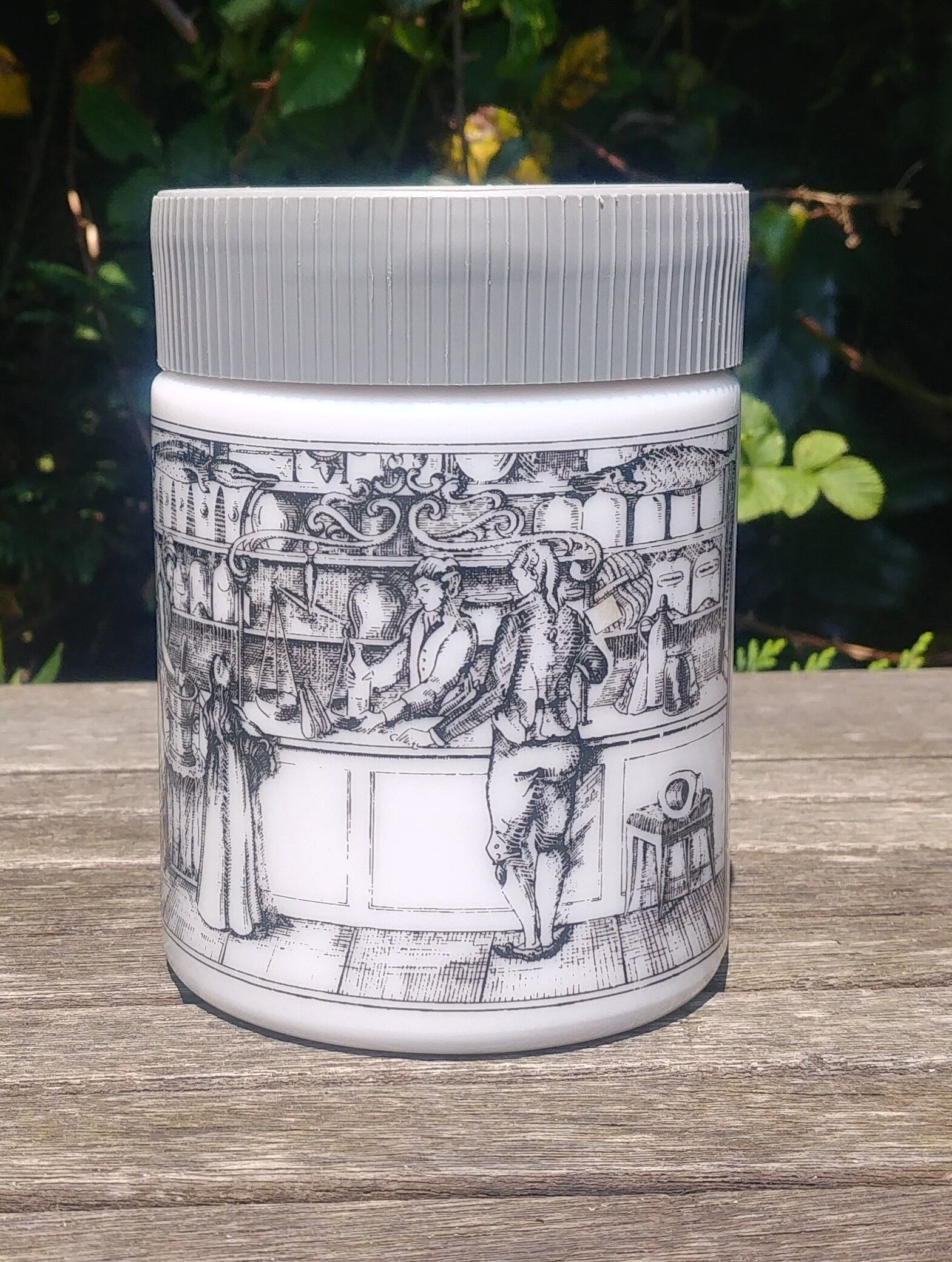 Antique pot in white opaline decorated with apothecary scene