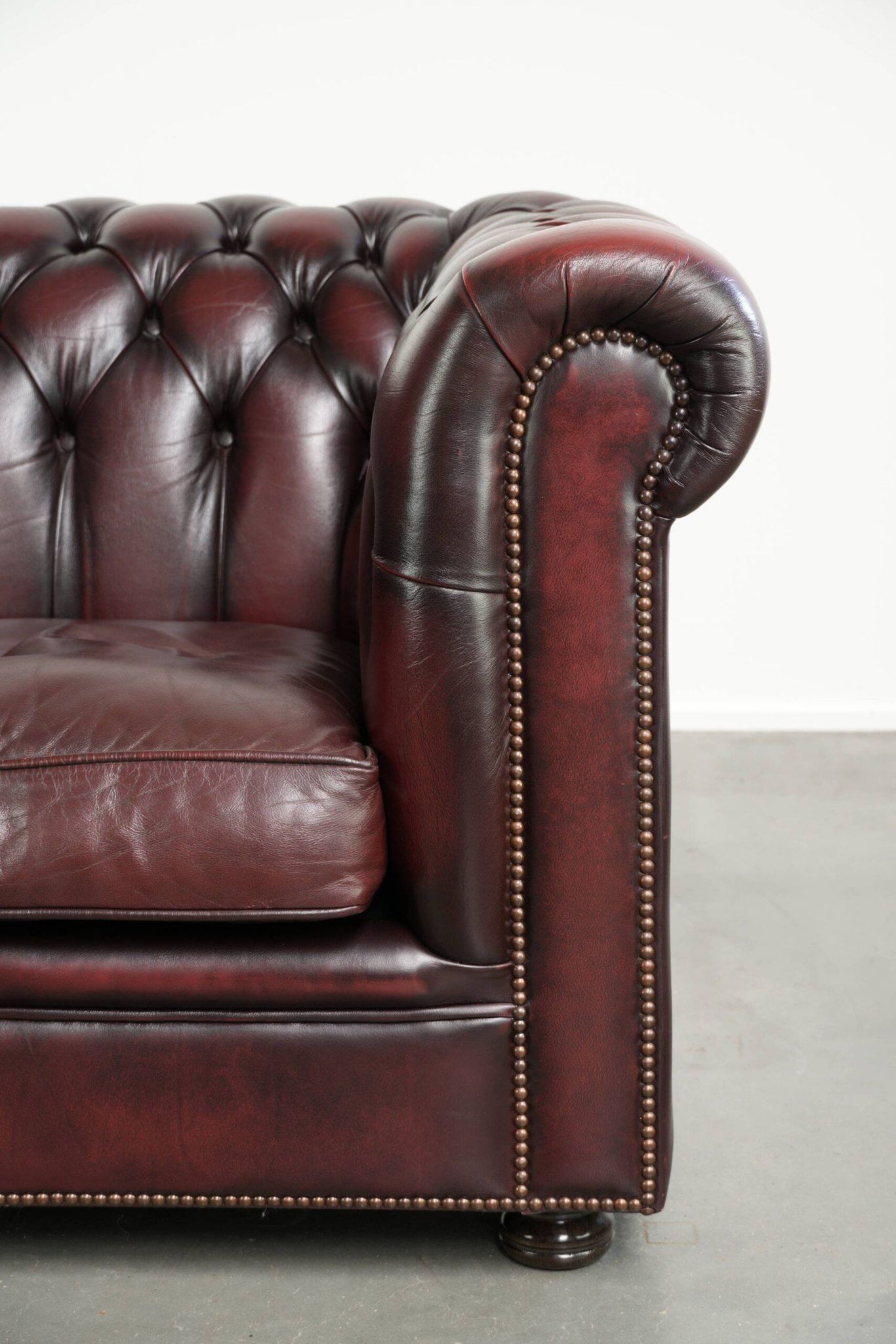 English cowhide Chesterfield club armchair in a beautiful red colour