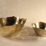 Two brass trundle cups