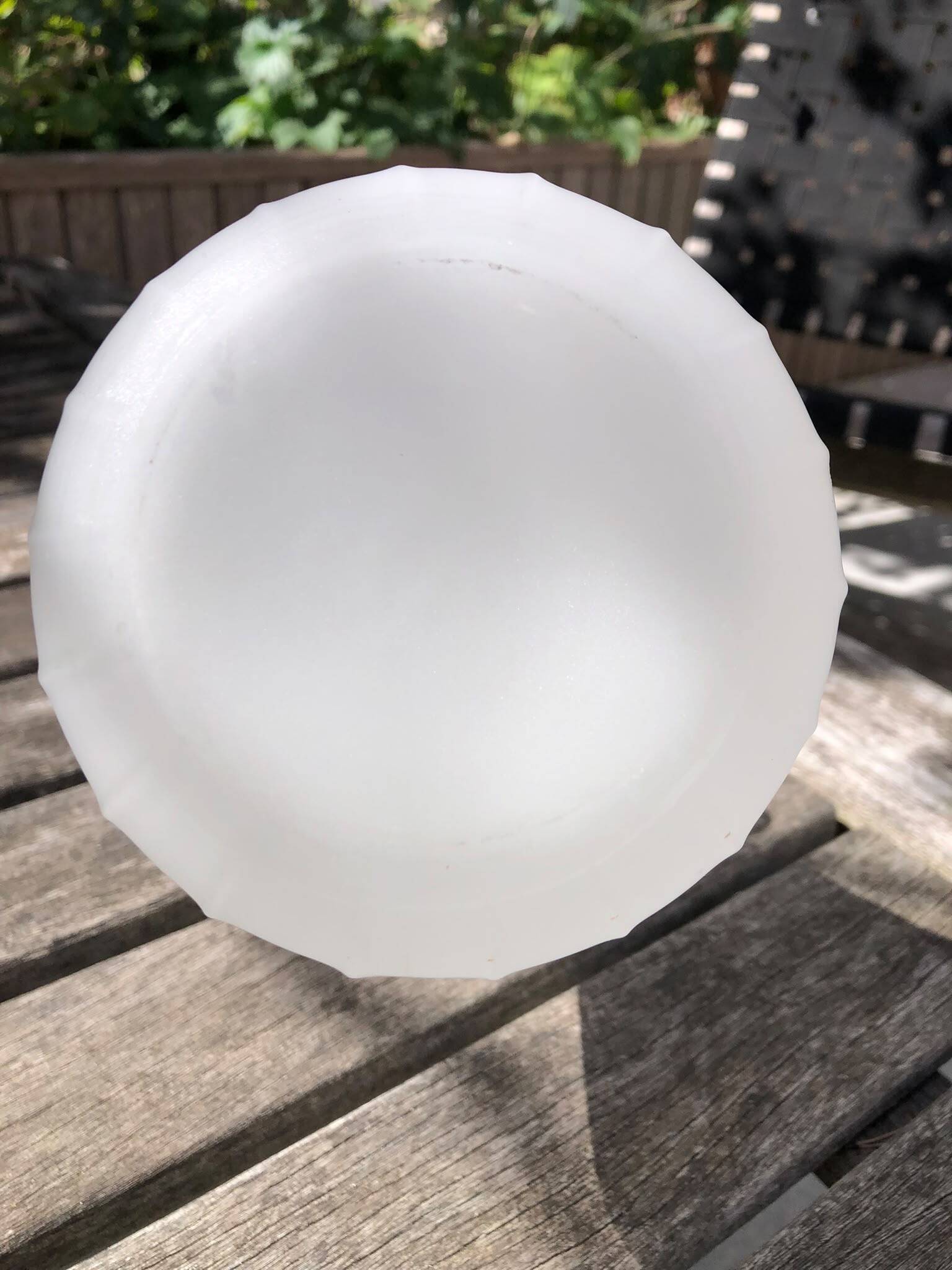 Vintage satin white glass vase with a wavy corolla