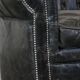 Spacious black cow leather chesterfield armchair with distinctive character