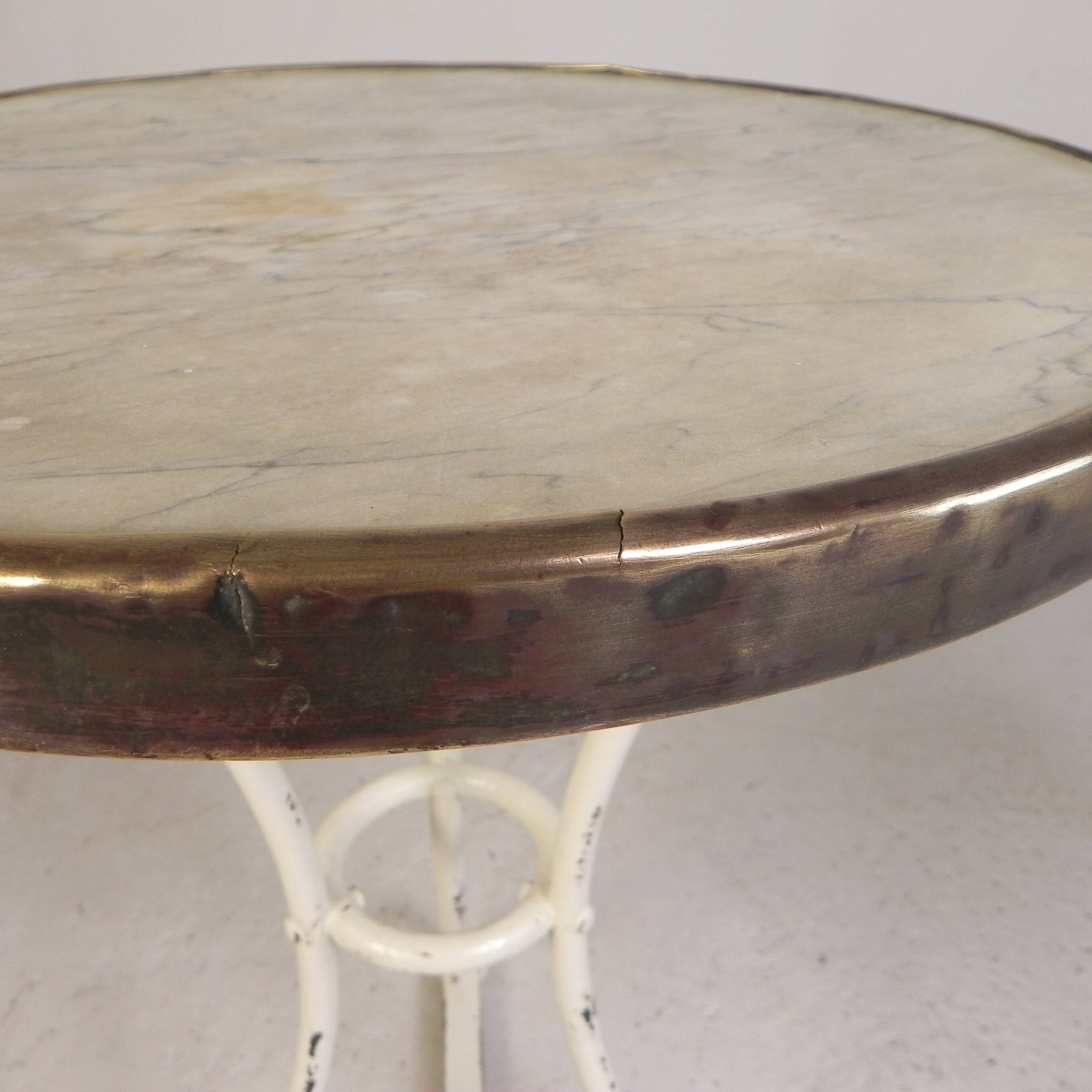 Bistro table with a marble top and brass edging, early 20th century.
