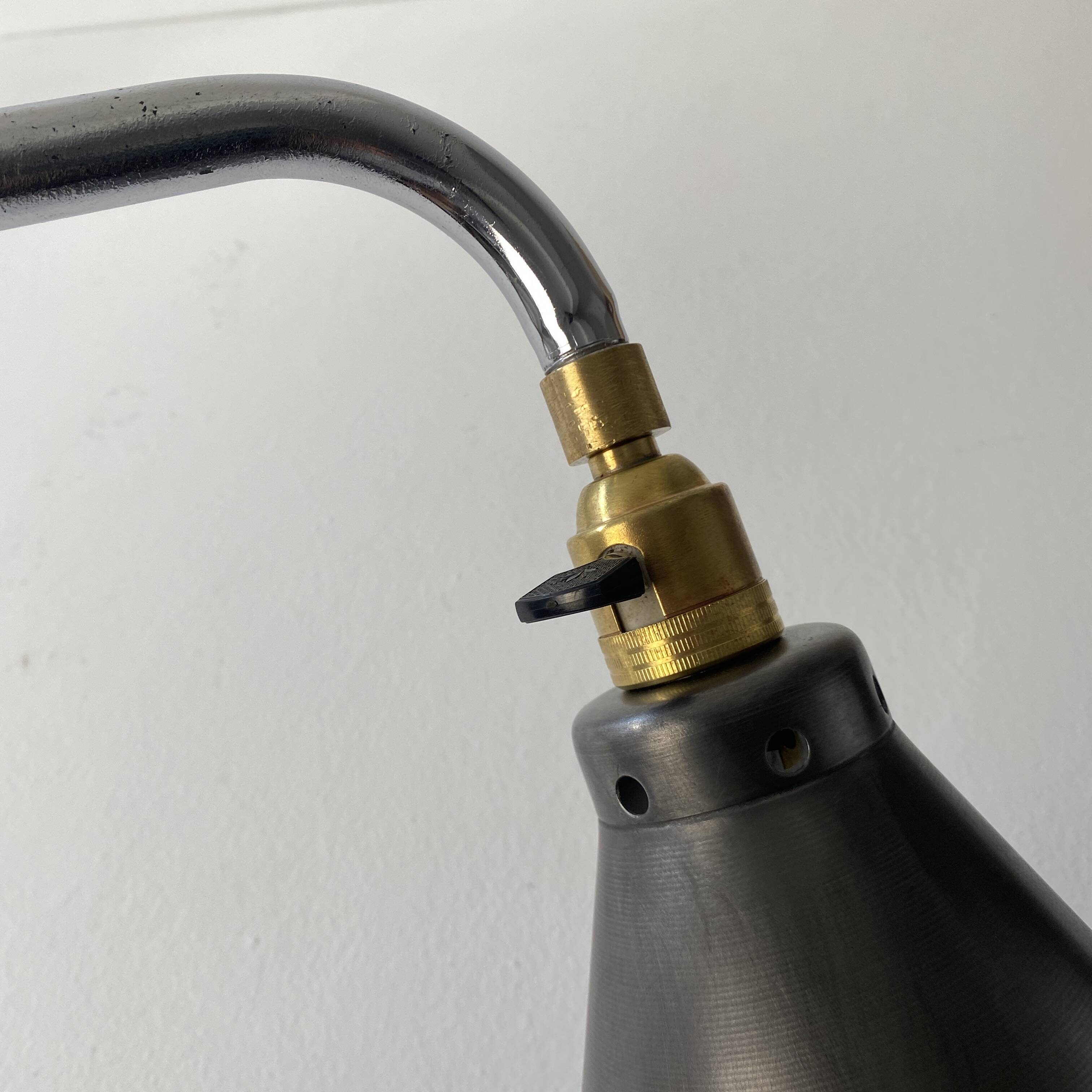 Old industrial wall light that is vintage.