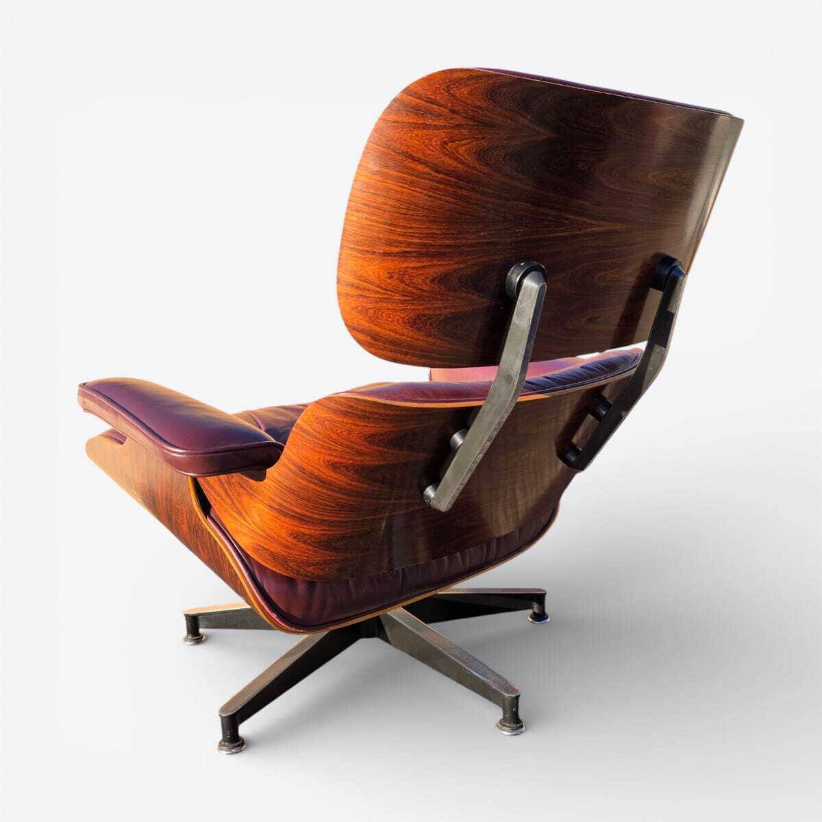 Original Eames lounge chair by Herman Miller in burgundy rosewood.