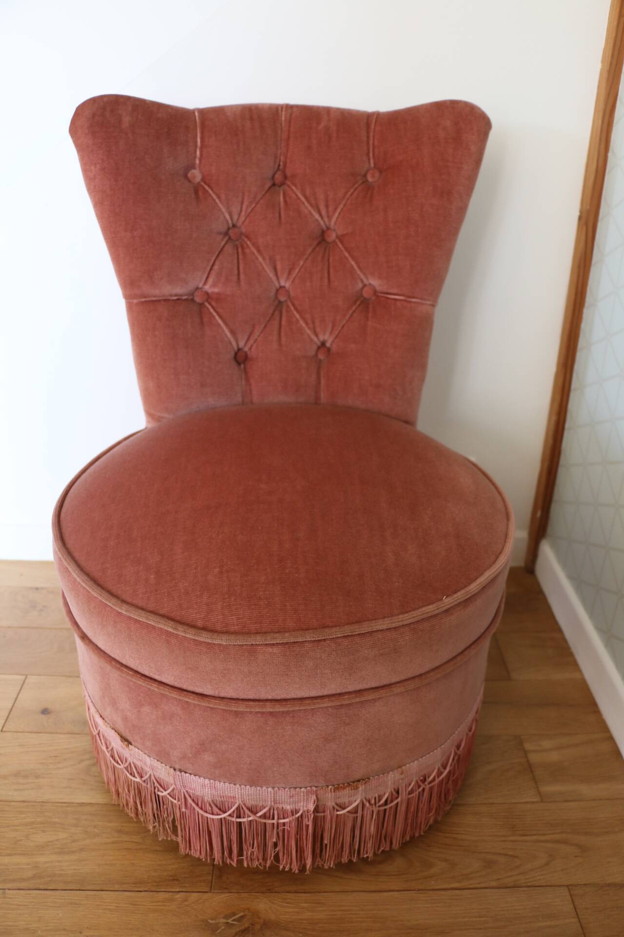 Powder pink fireside chair with fringes