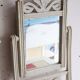 Small antique folding wooden dressing table with tiles and a mercury mirror.