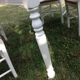 White farmhouse table set and four chairs