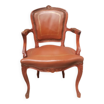Louis XV style armchair covered in leather.