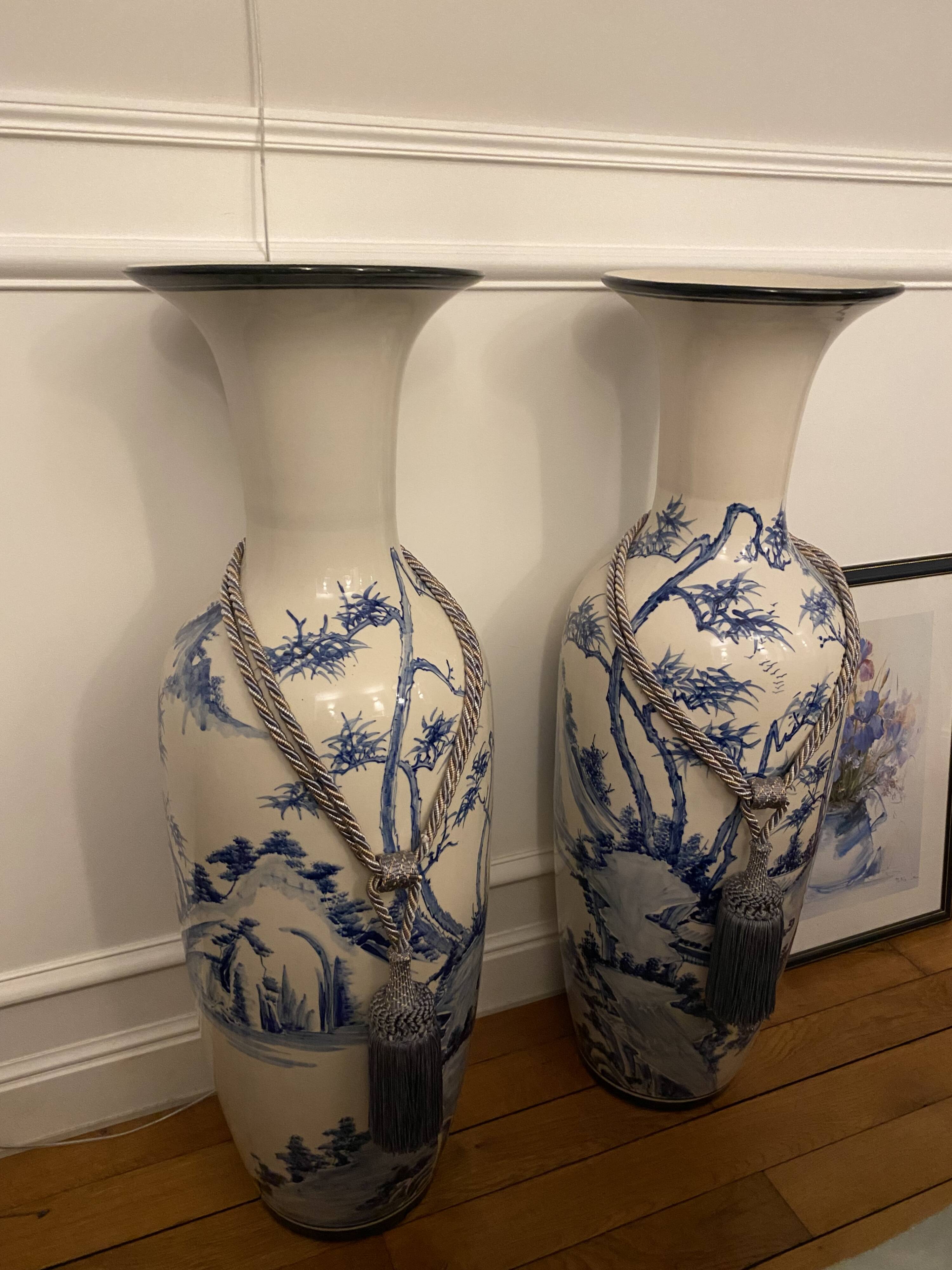 Set of two very large white and blue ceramic vases.