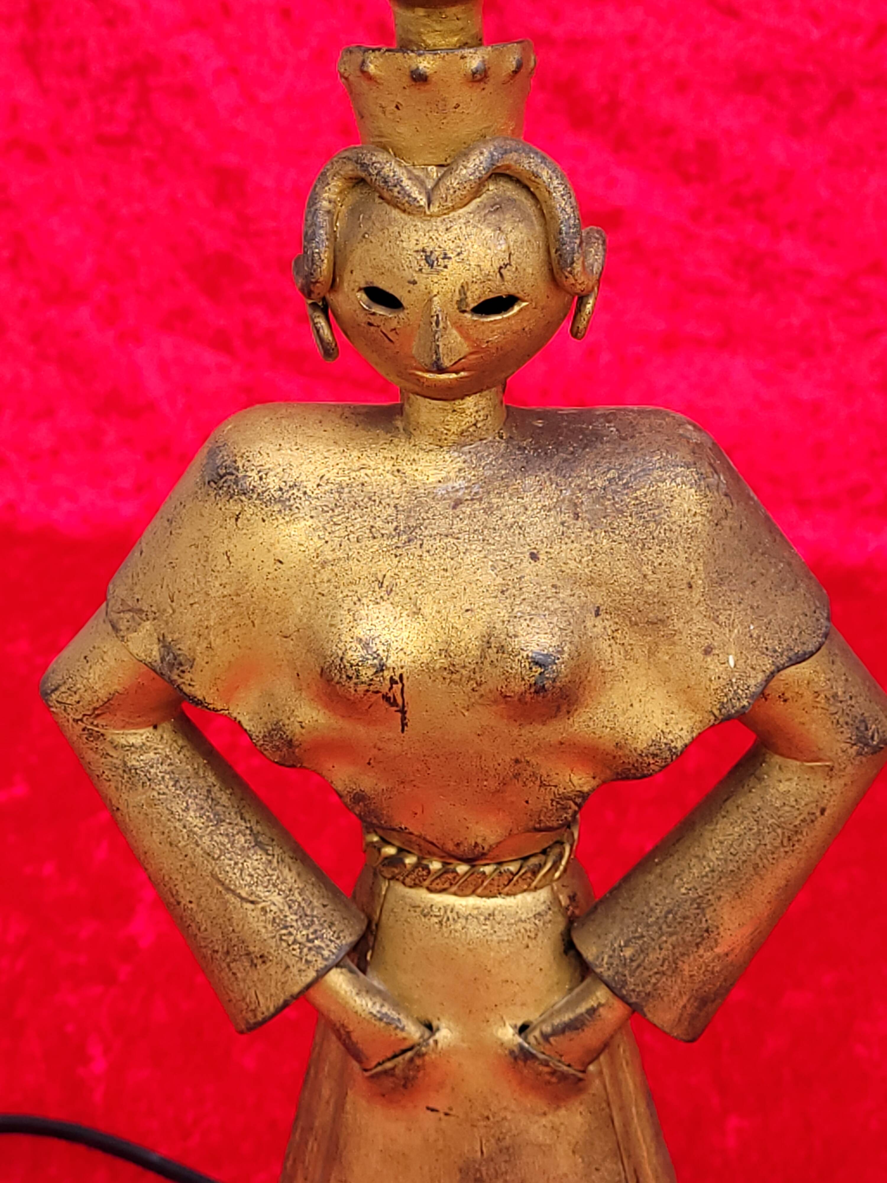 Pair of gilded beaten iron sculpture lamps attributed to Gilbert Poillerat