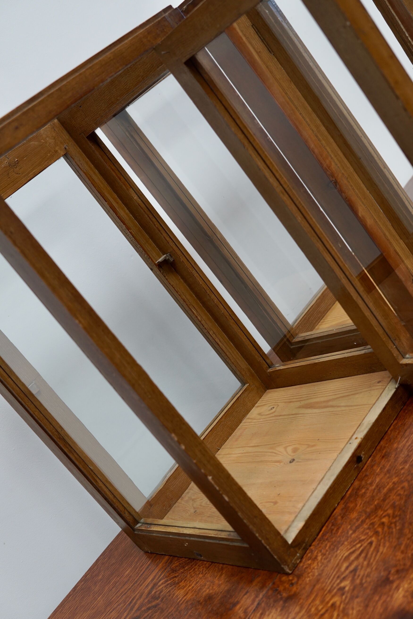 pair of faux oak shop display cabinets, circa 1920s