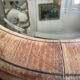 Oval beveled mirror surrounded by light wood dimension: height -74,5cm- width -38,5cm- prof-2cm-