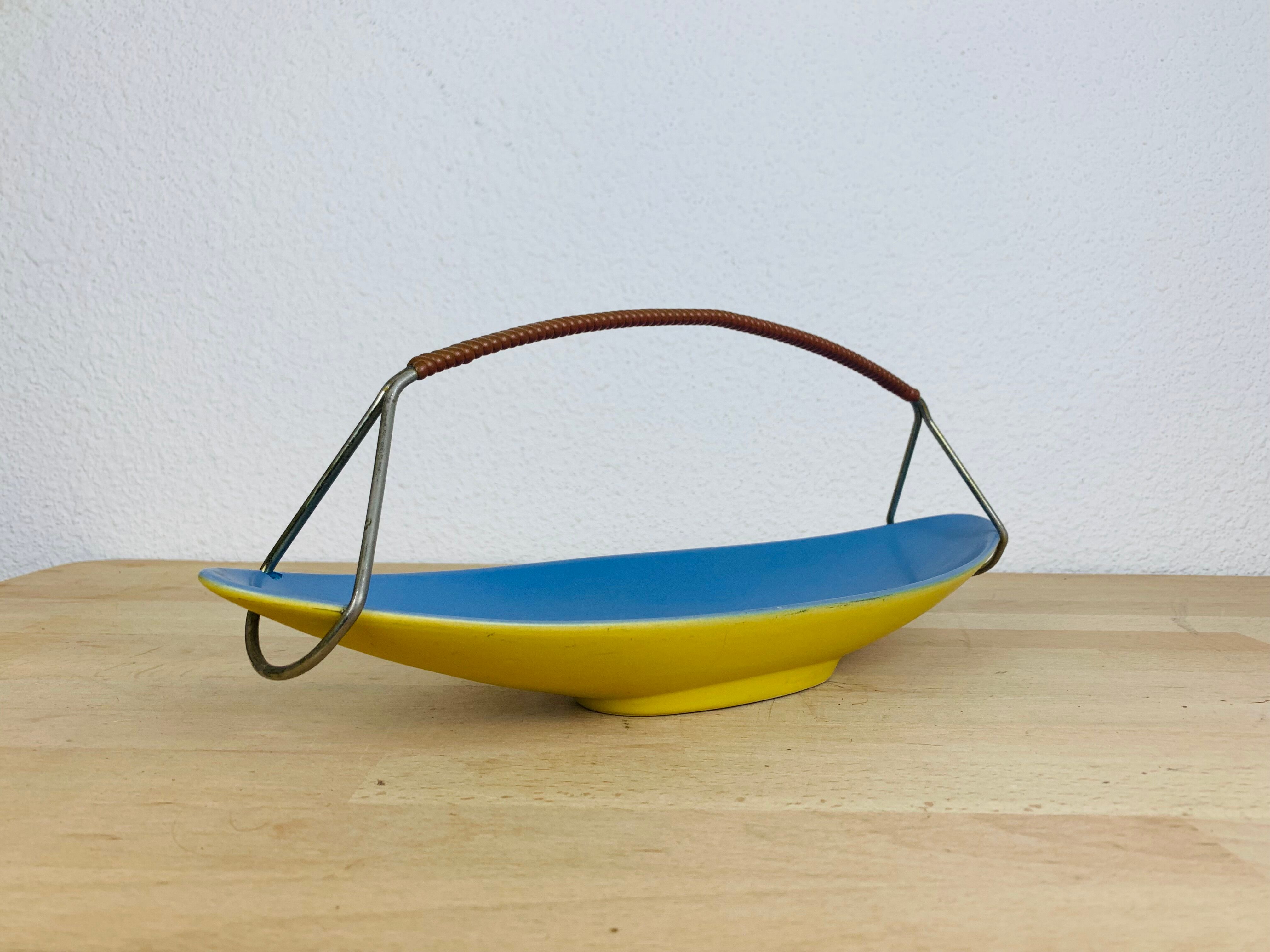 Empty ceramic shuttle pocket from the 50s