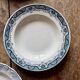 Set of 8 mismatched antique ironstone deep plates.