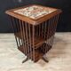 Rotating walnut library with a marble top.