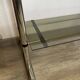 Chromed metal tubular shelf with smoked glass.