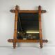 Wooden turned mirror in bamboo style, circa 1900-1930.