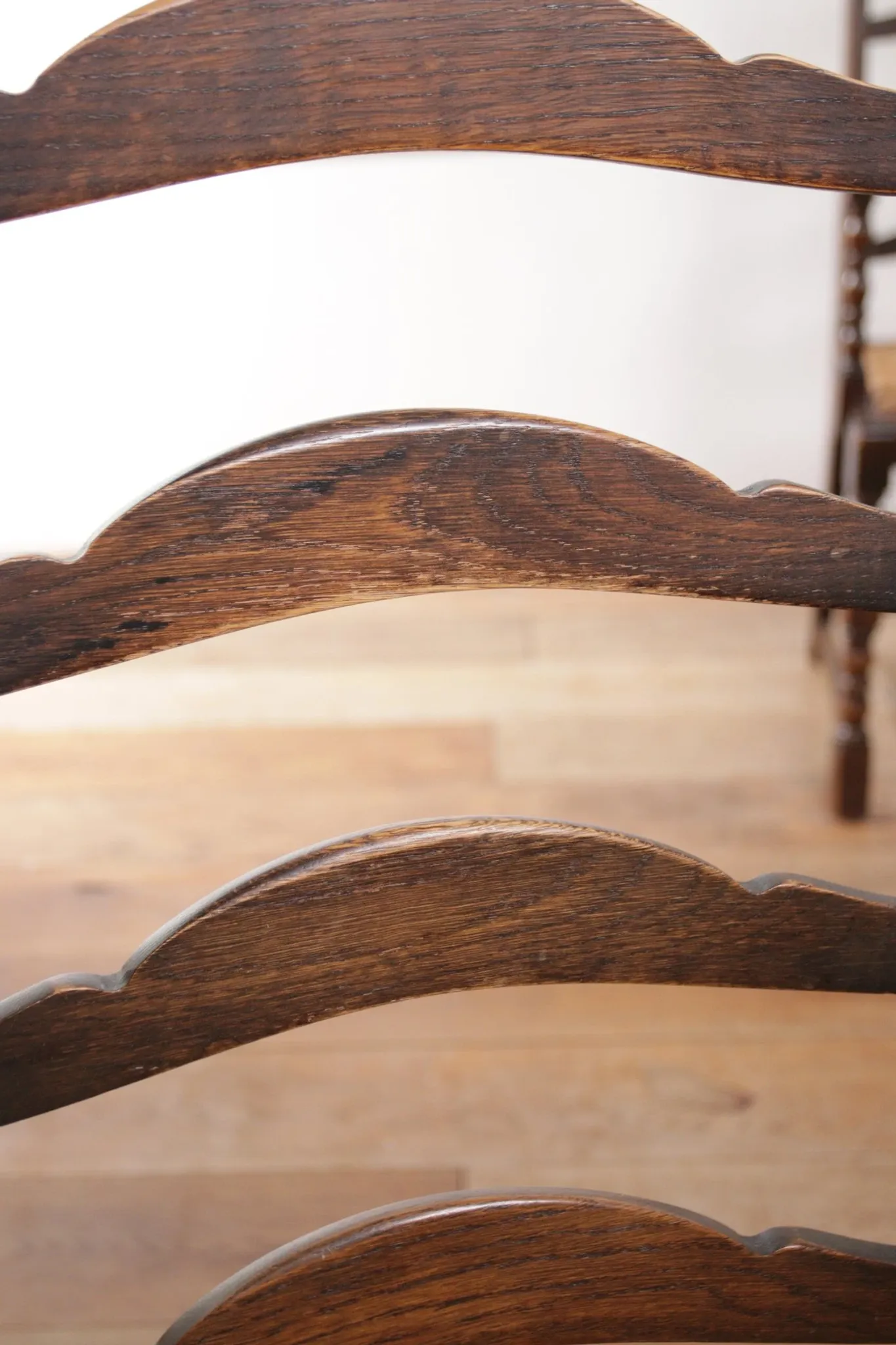 Pair of English oak armchairs with ladder back and rush seats
