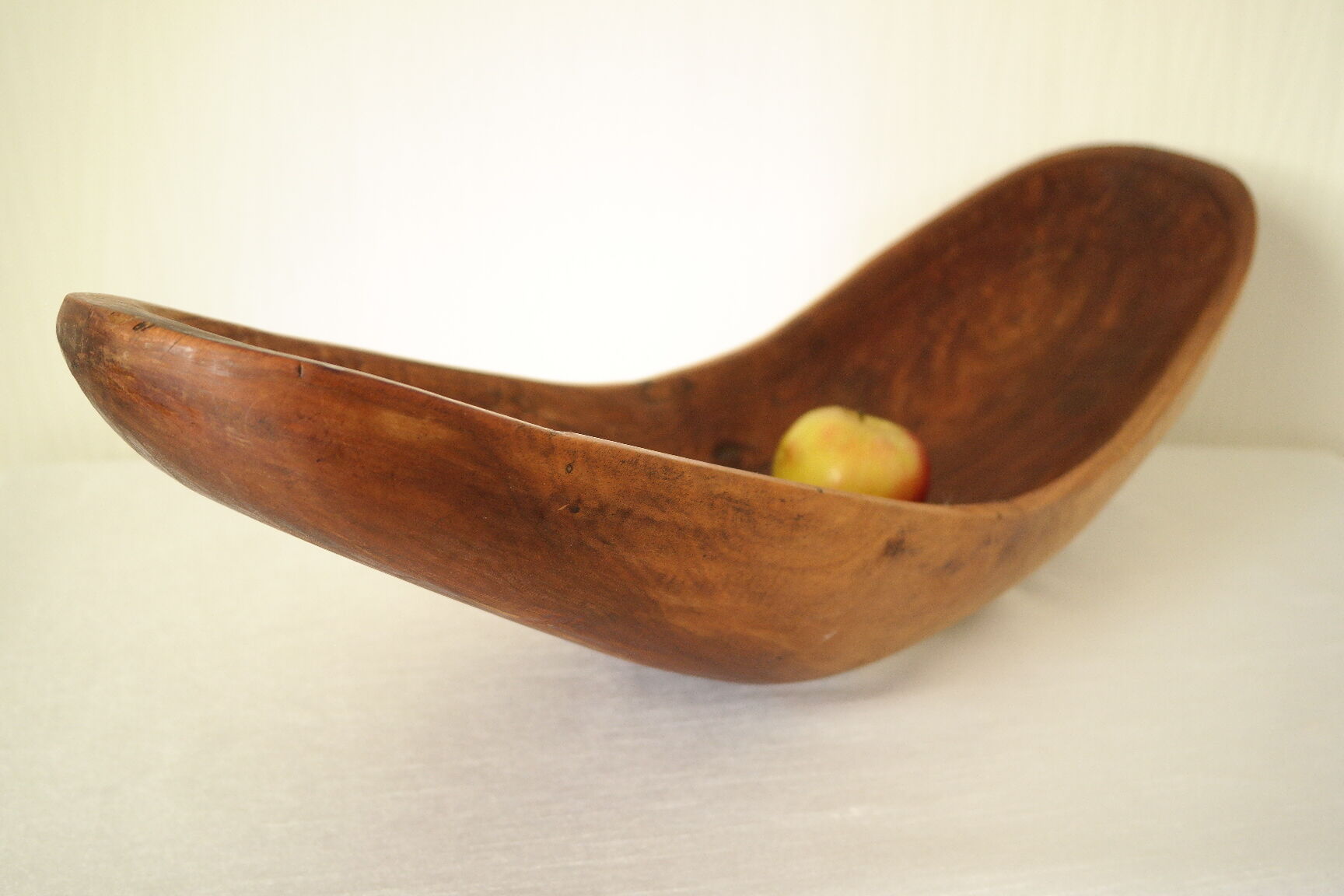 Brutalistic cut in exotic wood boomerang shape