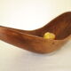 Brutalistic cut in exotic wood boomerang shape