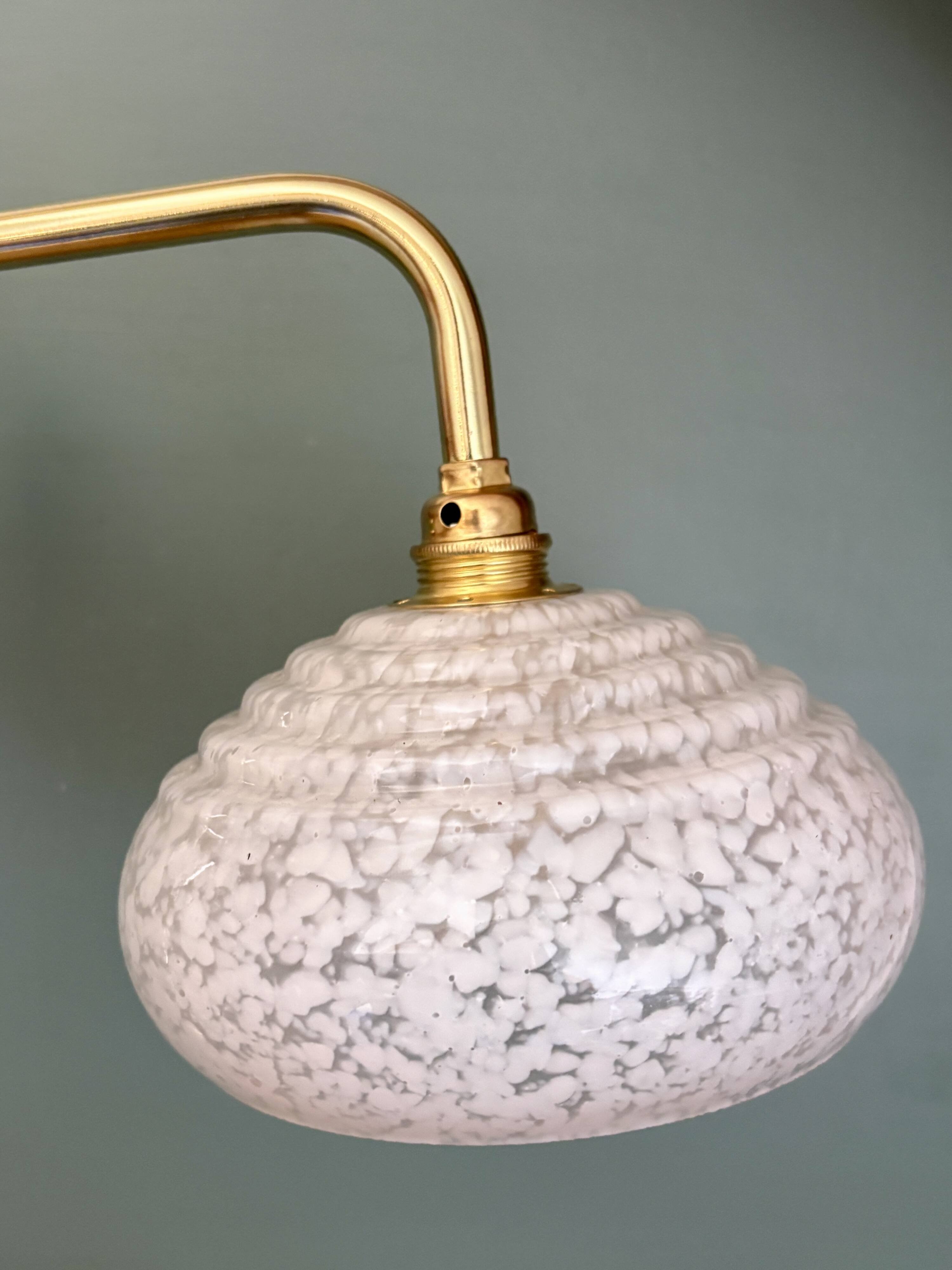 Vintage glass wall lamp with a white Clichy shade.