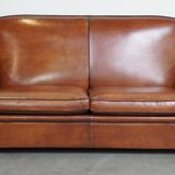 Very beautiful complete set consisting of a sheepskin leather sofa and two armchairs in cognac color