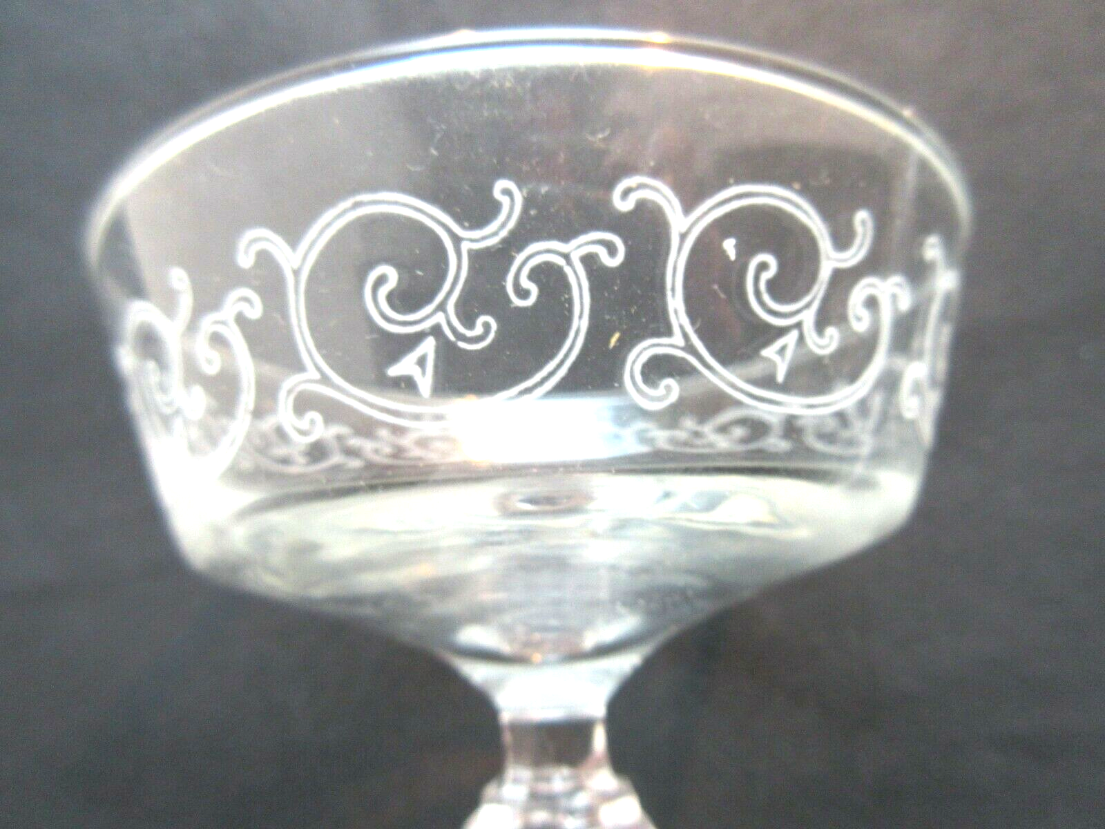 6 Louis XV style champagne glasses engraved with arabesques, baluster foot