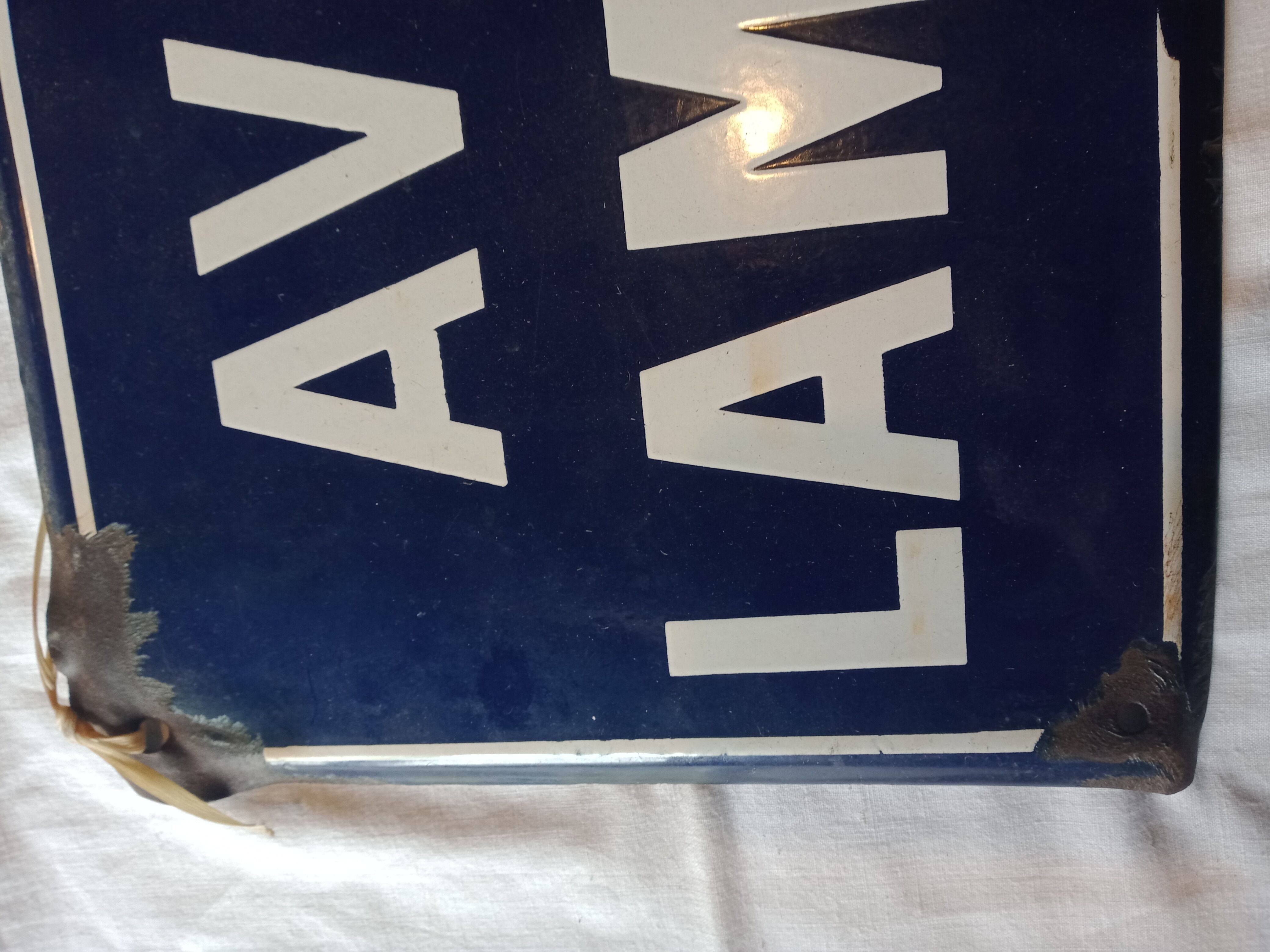Enamelled street sign