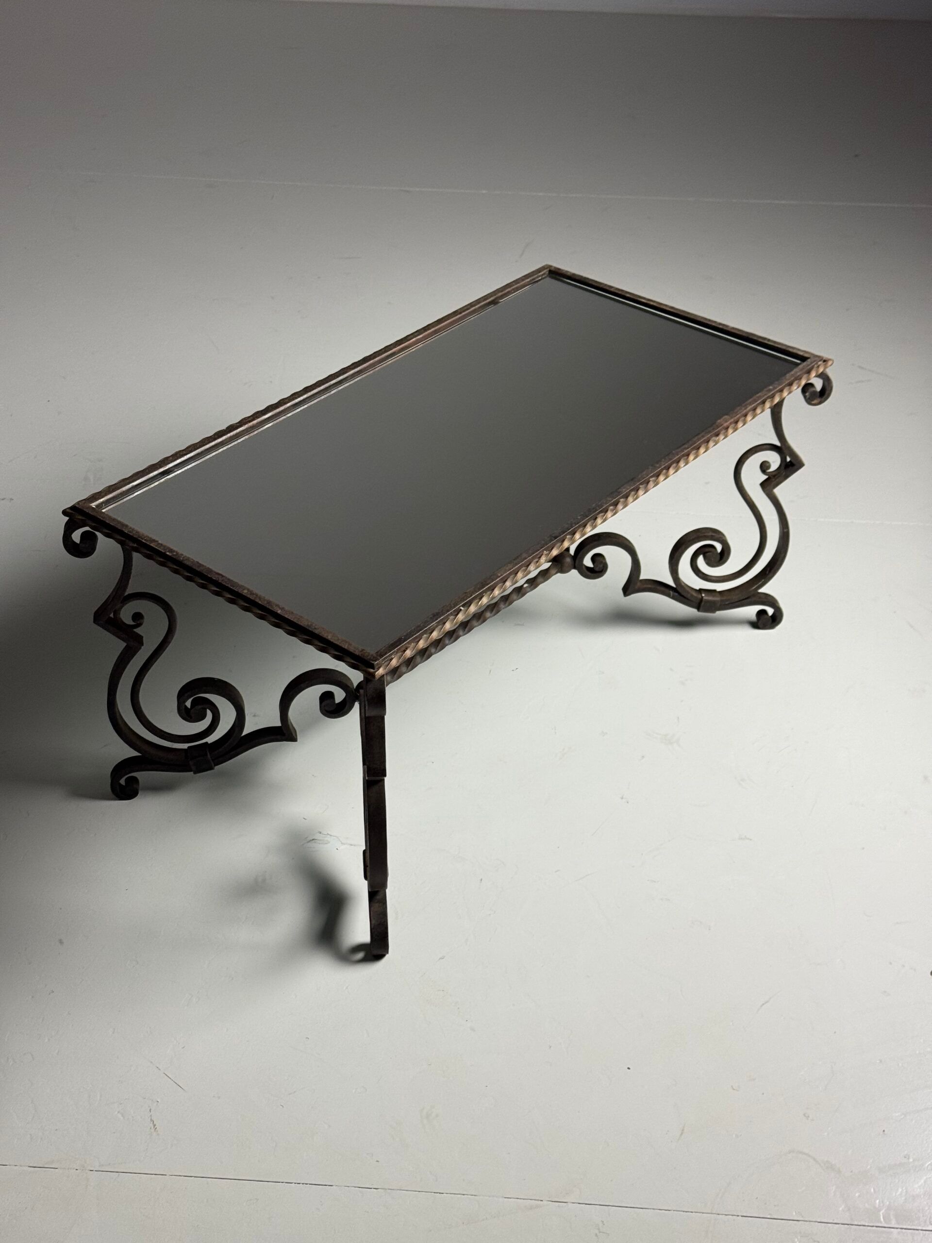 Wrought iron coffee table with mirror glass