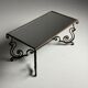 Wrought iron coffee table with mirror glass