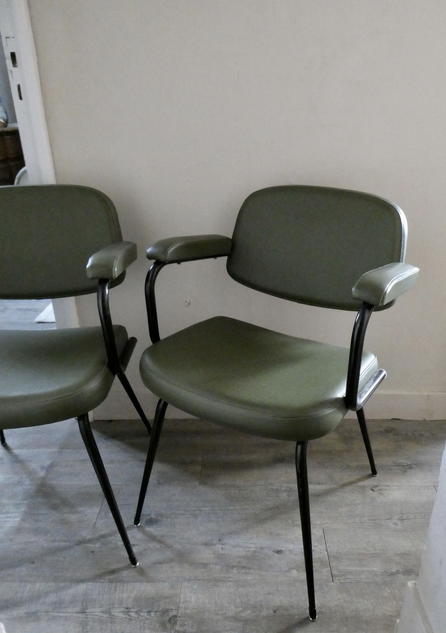 Pair of khaki green metal and skai armchairs from the 1960s