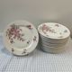 Series of 12 porcelain dessert plates decorated with flowers Bernardaud Limoges