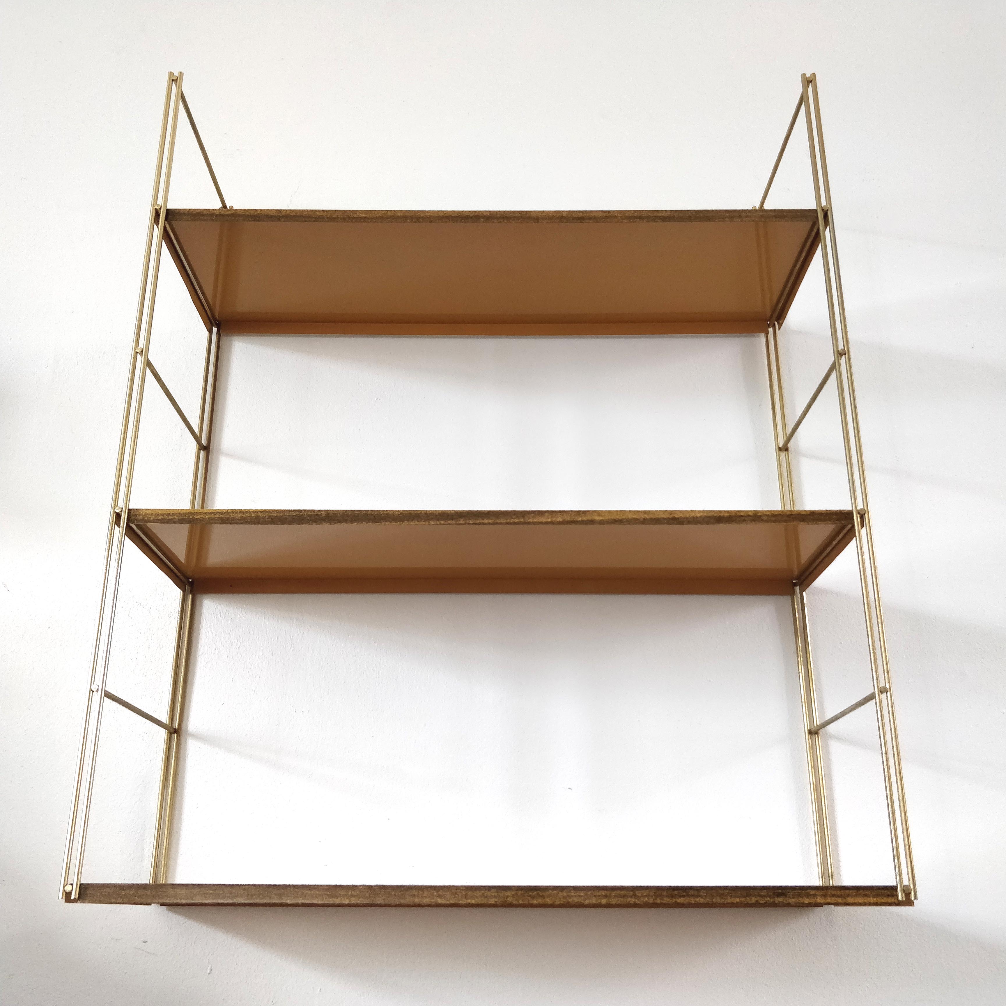 Brown metal string shelf and gilded studs 1960