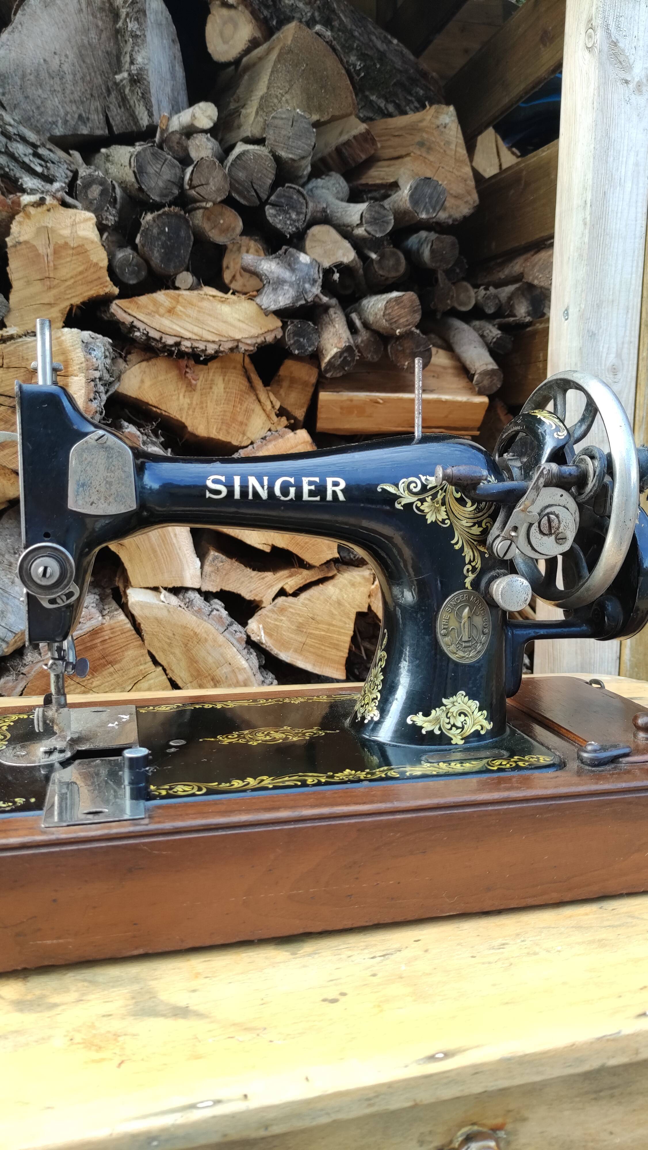 Old Singer sewing machine on its original base