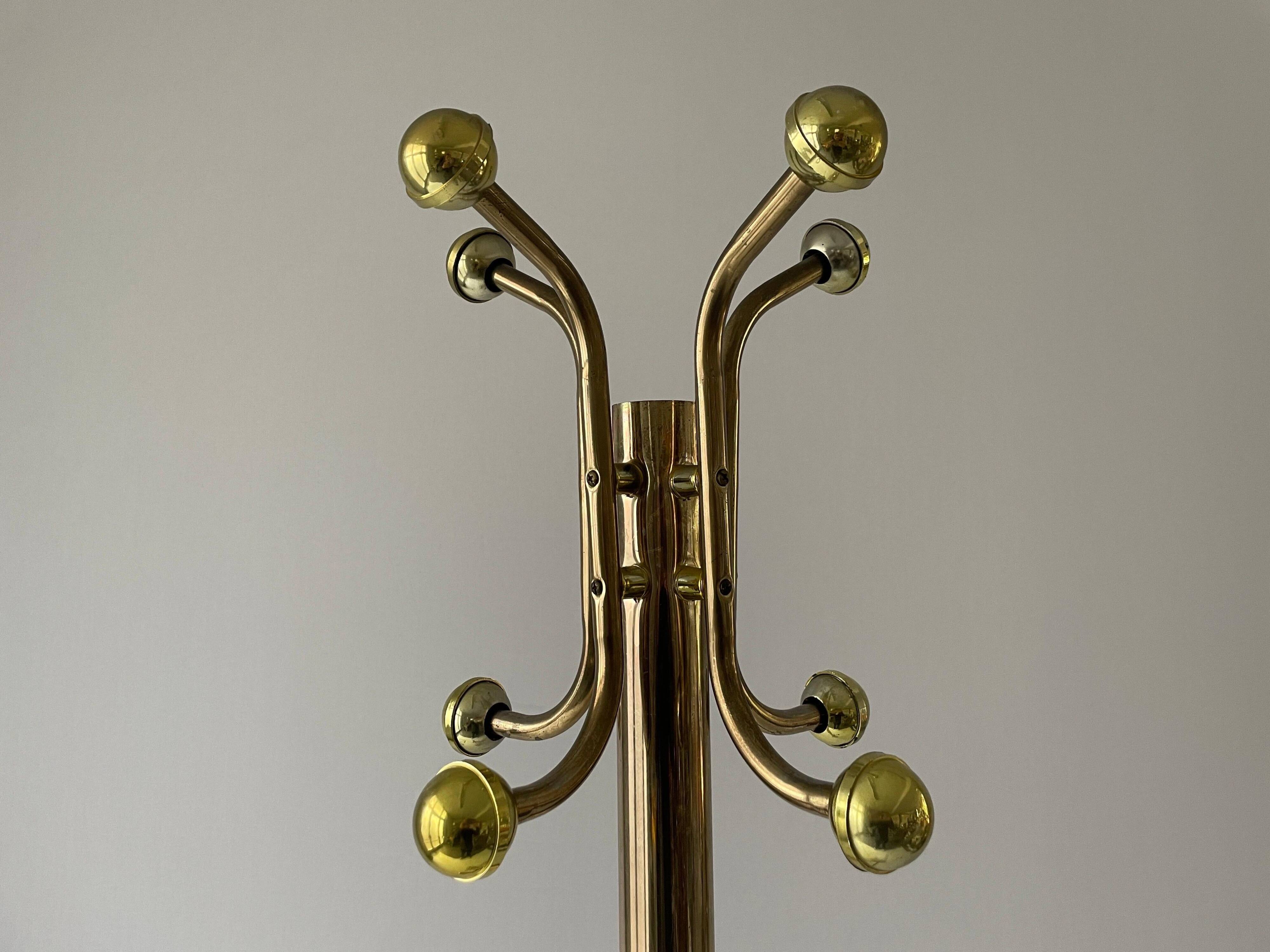 Free-standing coat rack in plexiglass with a marble base, 1960s, Germany.