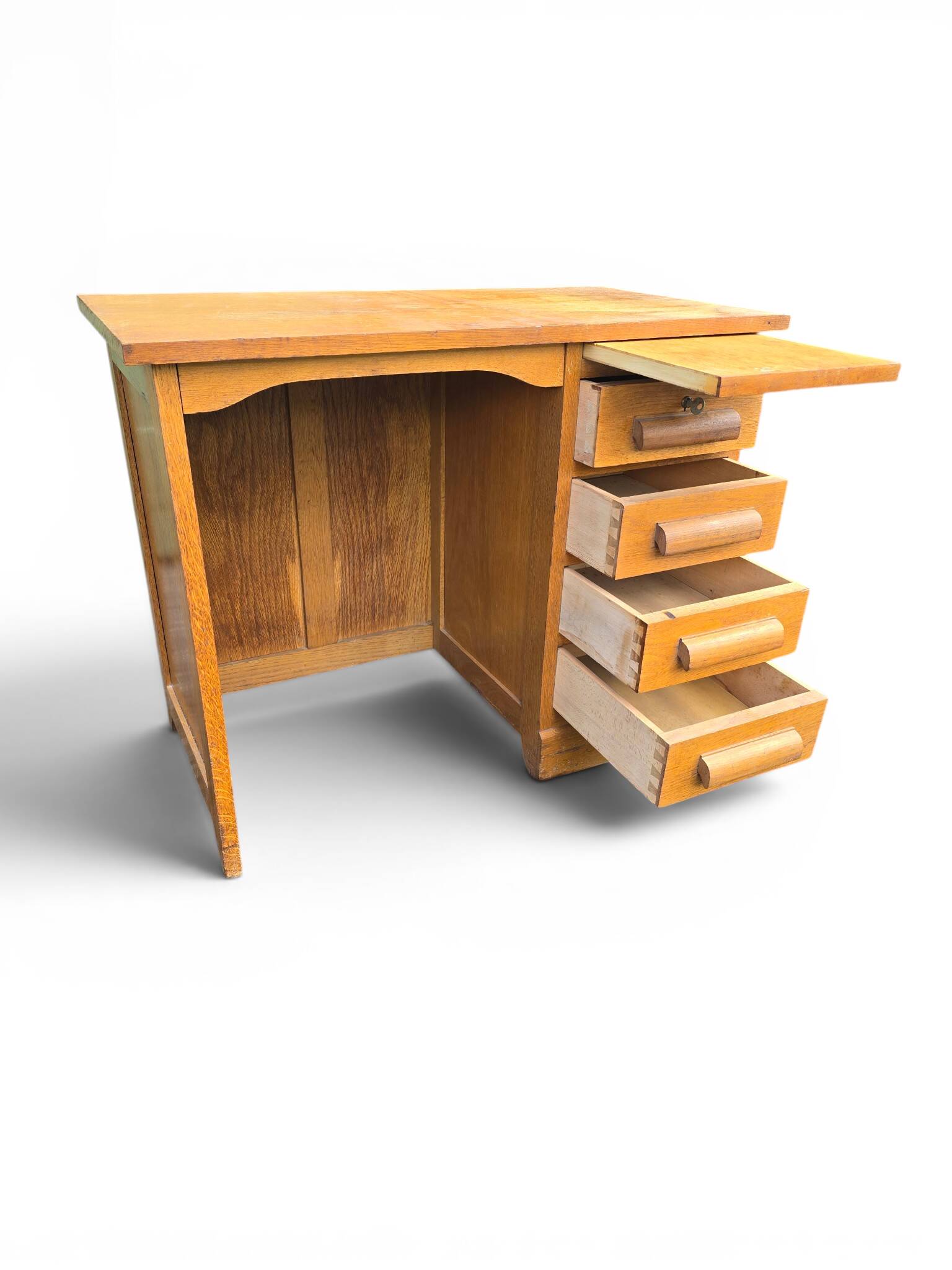 Vintage oak desk with a drawer unit and sliding shelf.