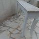 Console with a weathered grey cotton base, top in bleached walnut.