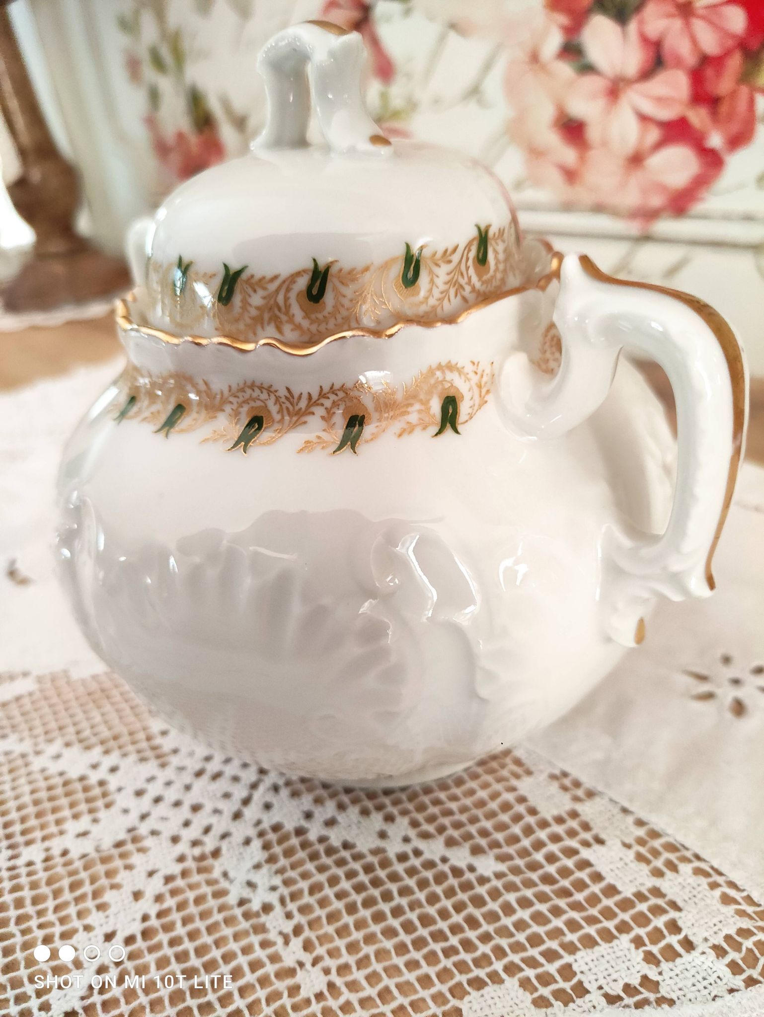 White porcelain sugar bowl decoration in relief and green and gold frieze