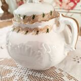 White porcelain sugar bowl decoration in relief and green and gold frieze
