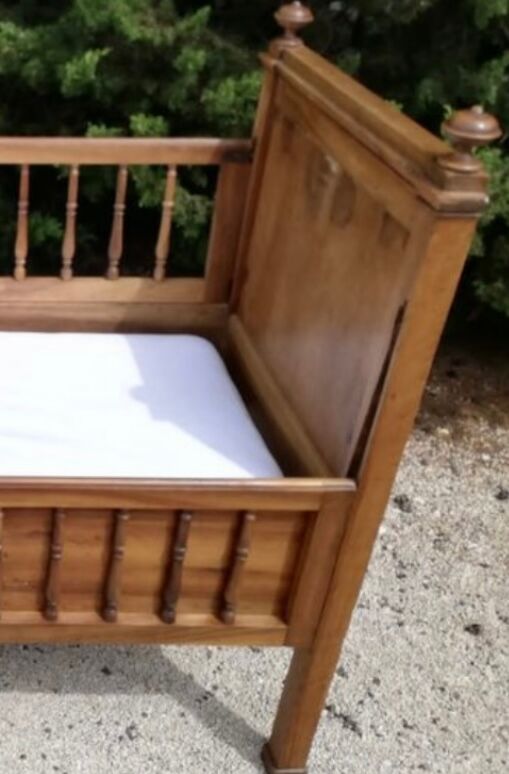 Old children's bed with retractable walnut bars