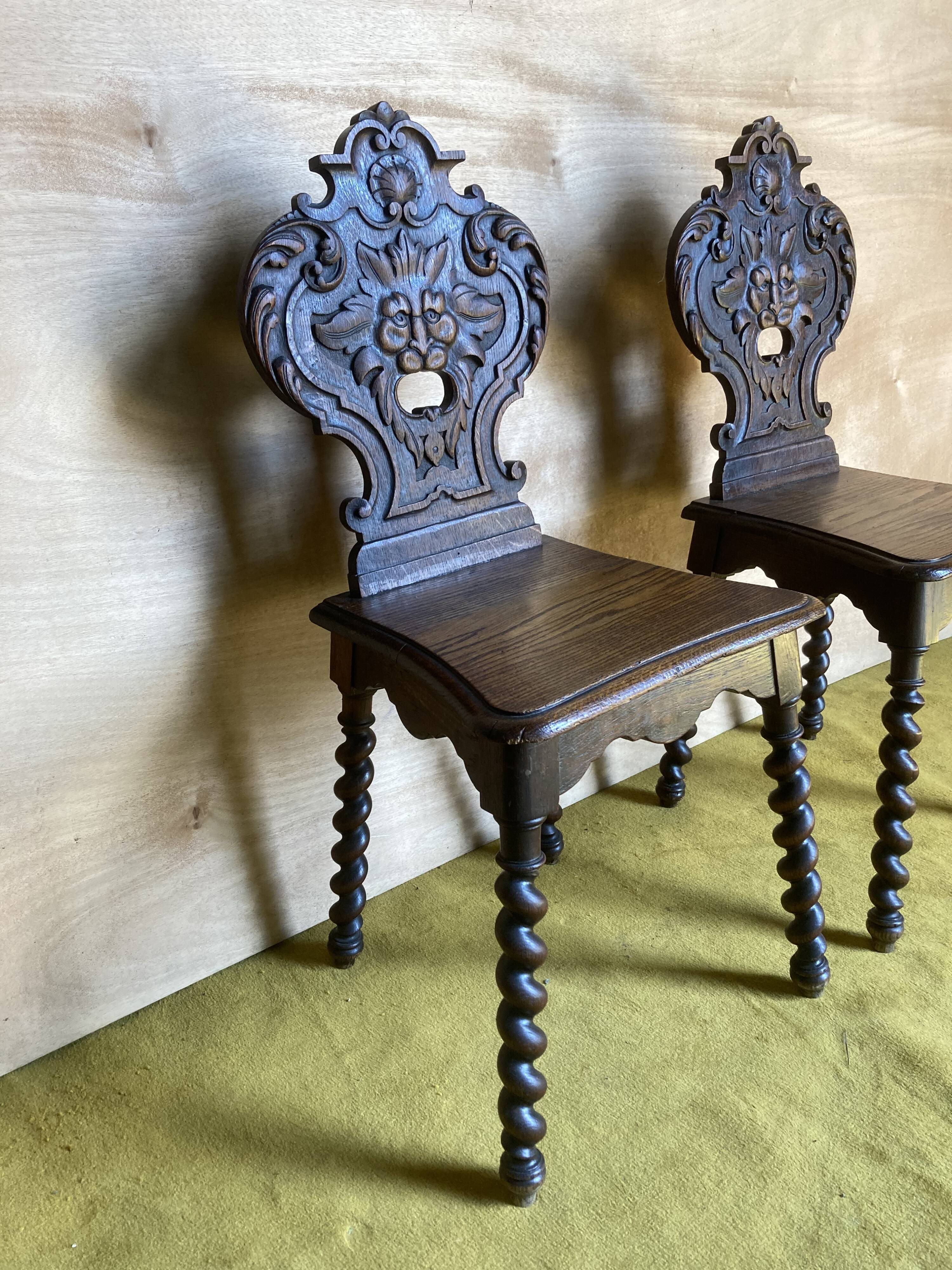 Duo of carved wooden chairs